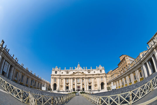 Facade of the Vatican, St Peter of Rome, Italy - Piazza San Pietro on a blue sky
