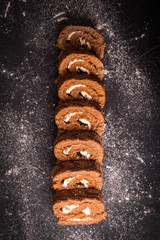 Sweet roll on a wooden background. Top view
