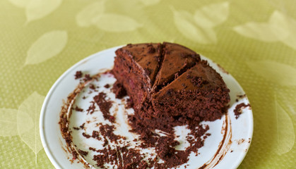 Homemade truffle-cranberry cake cut into pieces