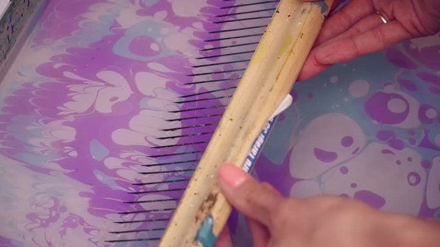 Creating violet painting using the ebru technique