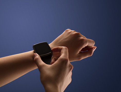 Close up female hand with balck smartwatch screen