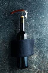 Bottle of wine with corkscrew.