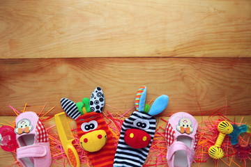 Children's toys and accessorieson a wooden background
