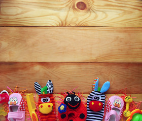 Children's toys and accessorieson a wooden background