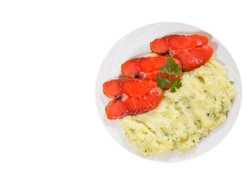 salmon steak with mashed potatoes on the plate. top view. isolated on white