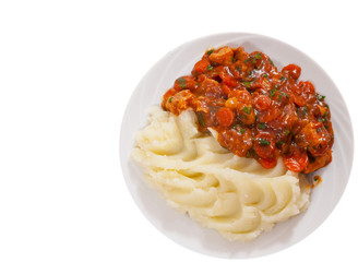 meat in sauce with mashed potatoes. top view. isolated on white