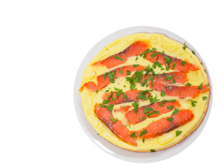 omelet with smoked salmon on plate. top view. isolated on white