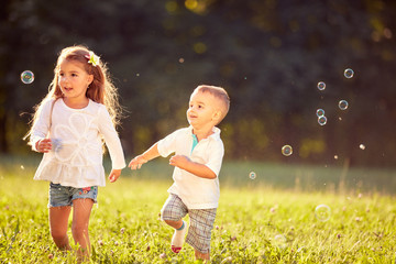 Fototapeta na wymiar Cheerful children running together