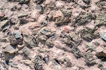 The texture of old stones together with cement.