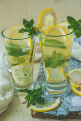 non-alcoholic or alcoholic Mojito Cocktail with lemon and mint
