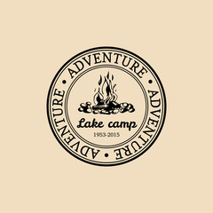 Vector camp logo. Tourist sign with hand drawn image of bonfire. Retro hipster emblem,badge,label of outdoor adventures.