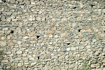 The texture of old stones together with cement.
