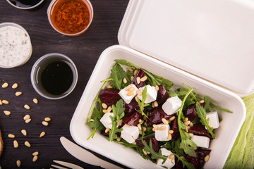 The baked beet with cheese feta, arugula and pine nuts, with olive oil