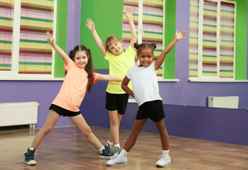 Fototapeta na wymiar Cute little girls dancing in choreography class