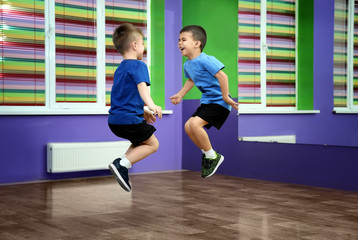 Little boys jumping in choreography class
