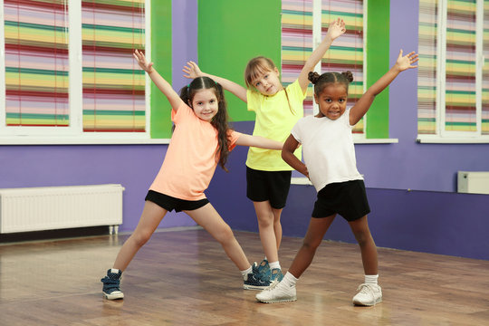 Cute little girls dancing in choreography class