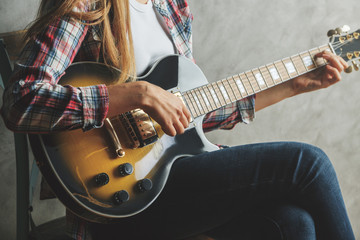 Female playing the guitar