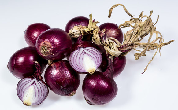 Fresh red sliced onion and bulbs background