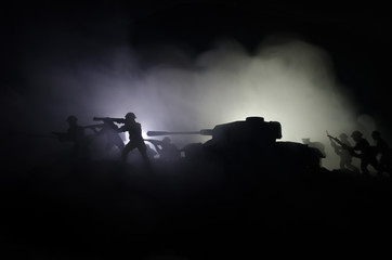 Fototapeta na wymiar Tanks in the conflict zone. The war in the countryside. Tank silhouette at night. Battle scene.