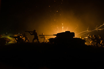 Tanks in the conflict zone. The war in the countryside. Tank silhouette at night. Battle scene.