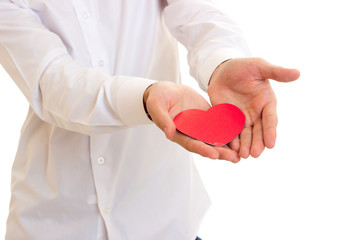 Young man holding a read heart 