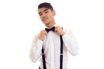 Young man with bow-tie and suspenders