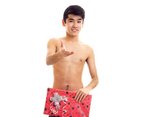 Undressed young man holding present