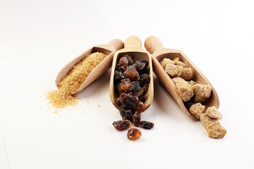 Composition with brown sugar on white background