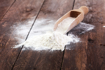 flour on wooden background