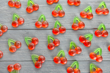 Tasty jelly candies on wooden background