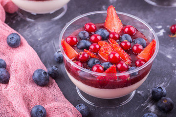 Milk jelly with home-made jam and fresh berries