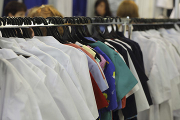 Fototapeta premium Medical uniform on a hangers in a shop