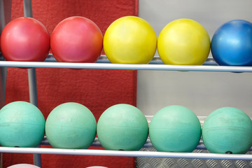 Balls on a stand in a fitness hall