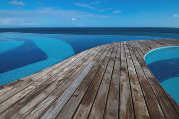 Ocean view from infinity pool with wood deck