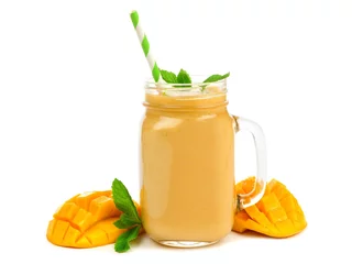 Abwaschbare Fototapete Milchshake Mango coconut smoothie in a mason jar glass with mint and straw isolated on white
