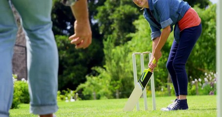 Couple playing cricket - Powered by Adobe