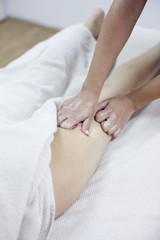 Fototapeta na wymiar Anti cellulite massage for young woman in beauty salon