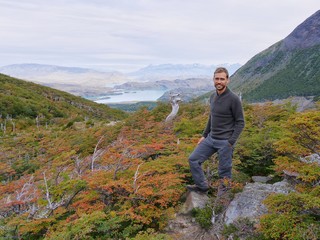 Young man smiling in scenic landscape