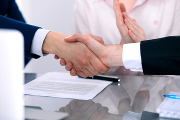 Business people shaking hands finishing up a meeting