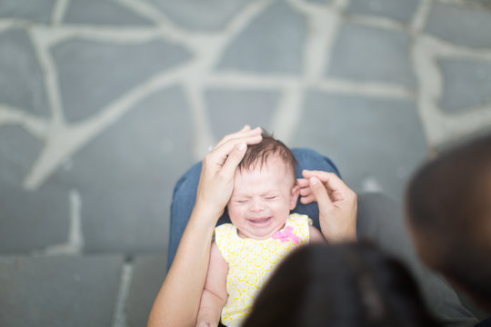 newborn fusses in mothers lap