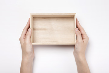 woman hand hold a wood gift box isolated white.