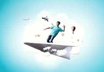 Hipster guy surfing sky . Mixed media