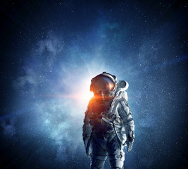 Obraz premium Astronaut in outer space. Mixed media . Mixed media