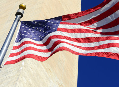 American Flag waving in the wind in patriotic concept