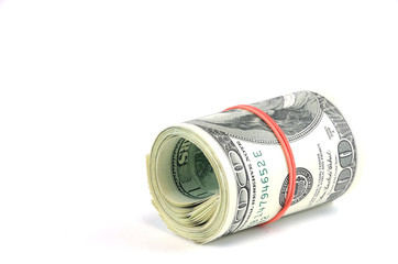 roll of hundred USA dollar bills with red rubber