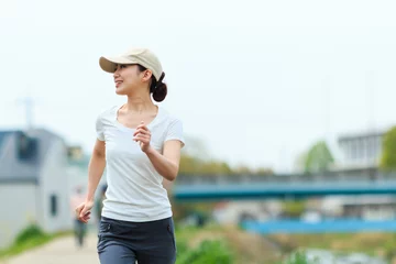 Papier Peint photo Lavable Jogging ジョギングをしている女性