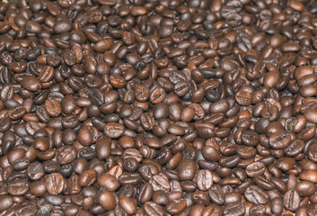 Roasted coffee beans for used as a texture background. Concept coffee lover.