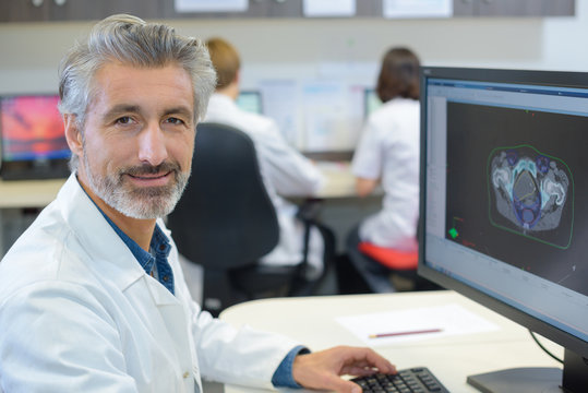 Portrait of male healthworker using computer