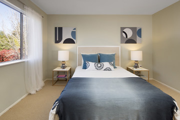 Residential bedroom with modern paintings