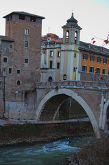 Naklejka premium The Tiberina Island and the Pons Fabricius or Ponte dei Quattro Capi, is the oldest Roman bridge in Rome, 62 BC. Rome, Italy